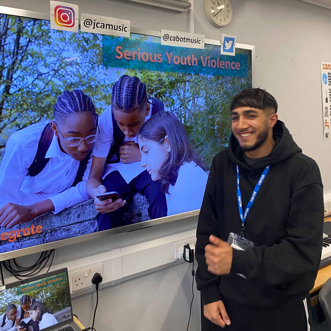 Education and outreach - photo of workshop being run by a young person.